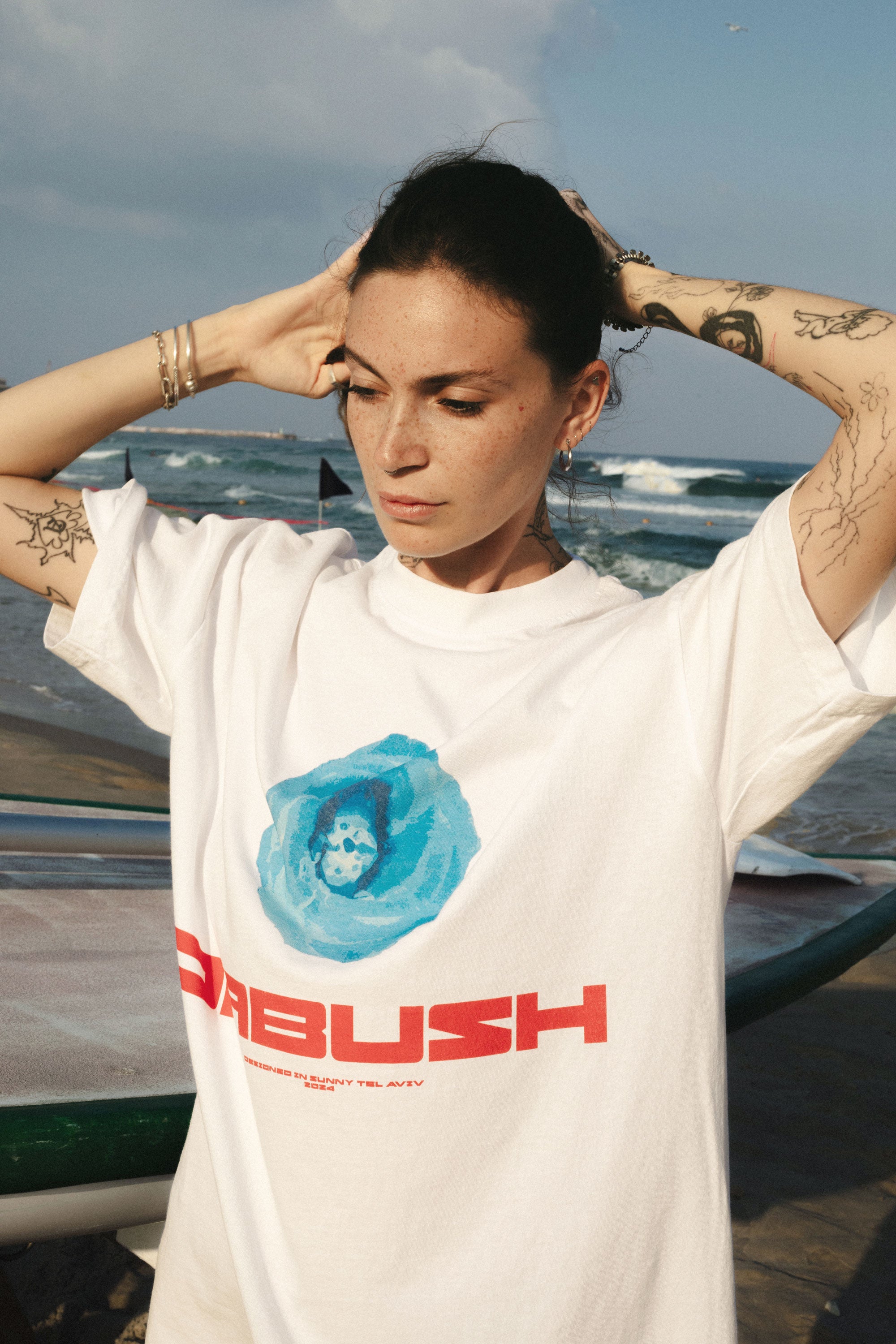 DABUSH T-SHIRTS. 100% Cotton, oversized tee with Back and front print. Made in Tel aviv. Shop and view the latest Drops from the official DABUSH website. Worldwide Shipping. DABUSH is a publishing house, design studio and a brand based in Tel Aviv, Israel.