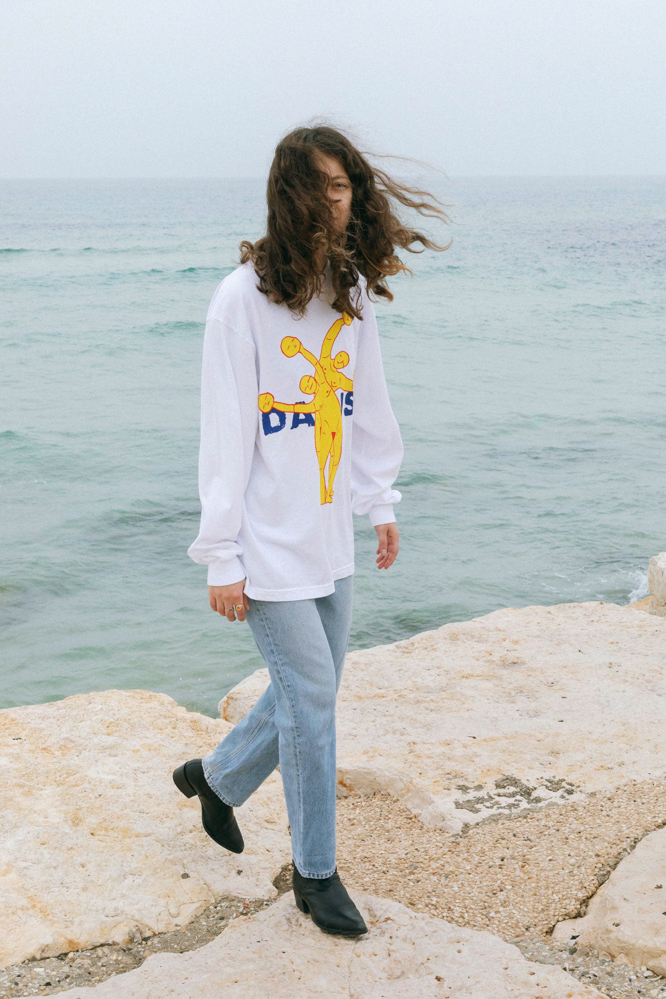 DABUSH SYNERGY LONG SLEEVE T-SHIRT. TEAMWORK MAKES THE DREAM WORK. 100% Cotton, oversized long sleeves tee with huge front and back print. Made in Tel aviv. Shop and view the latest Drops from the official DABUSH website. Worldwide Shipping.