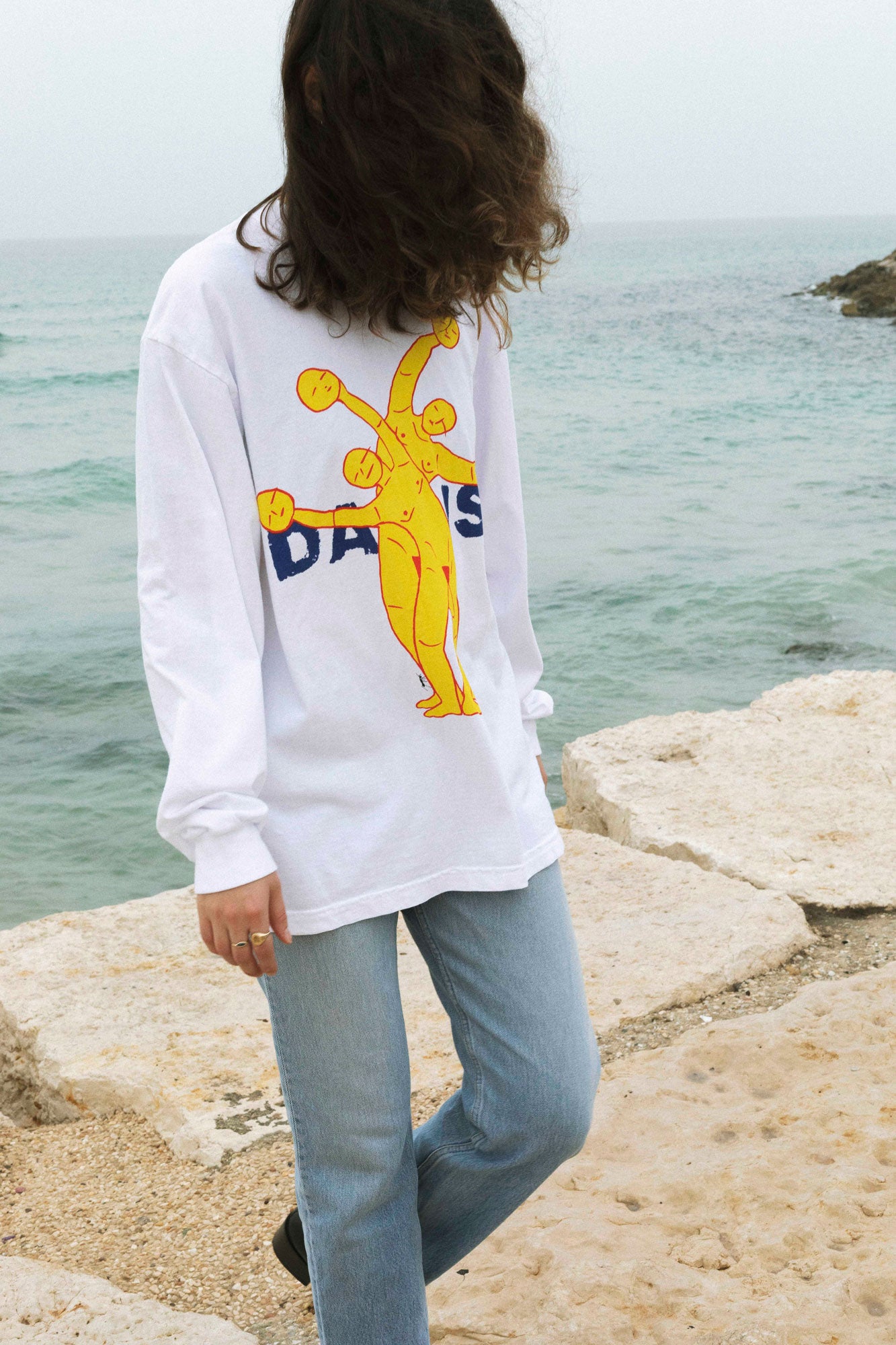 DABUSH SYNERGY LONG SLEEVE T-SHIRT. TEAMWORK MAKES THE DREAM WORK. 100% Cotton, oversized long sleeves tee with huge front and back print. Made in Tel aviv. Shop and view the latest Drops from the official DABUSH website. Worldwide Shipping. 