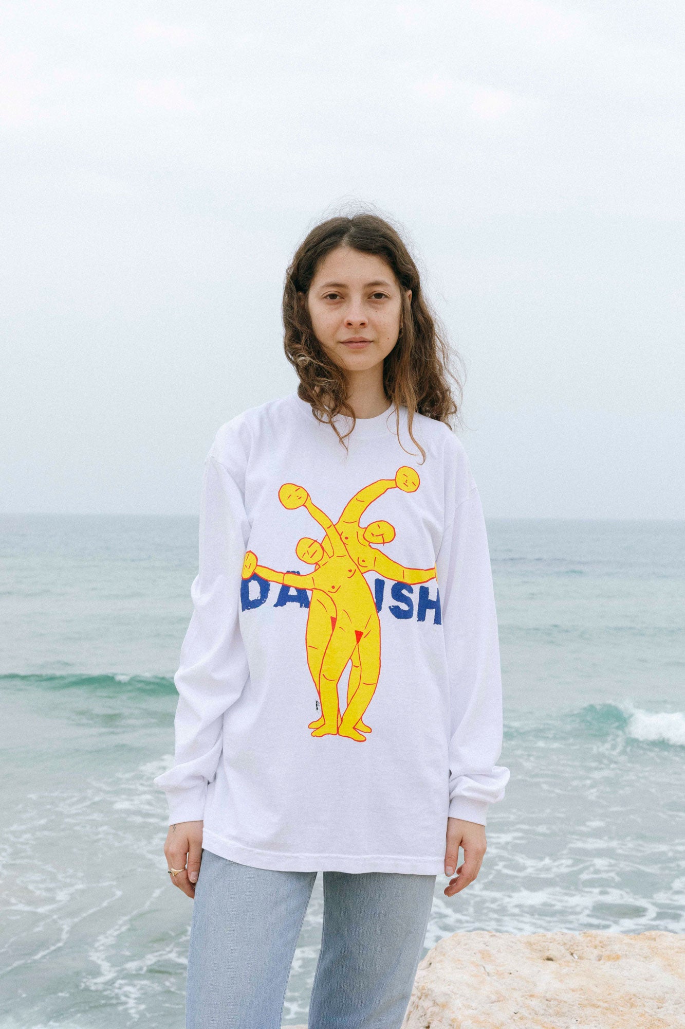 DABUSH SYNERGY LONG SLEEVE T-SHIRT. TEAMWORK MAKES THE DREAM WORK. 100% Cotton, oversized long sleeves tee with huge front and back print. Made in Tel aviv. Shop and view the latest Drops from the official DABUSH website. Worldwide Shipping.