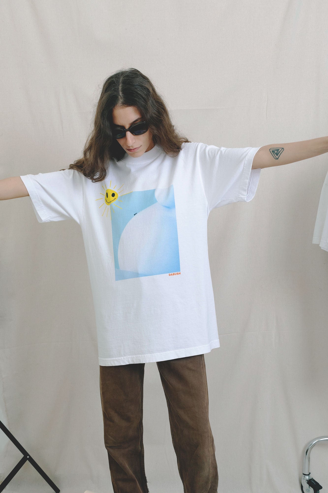 DABUSH PROTECTION T-SHIRT. 100% Cotton, oversized tee with  Back and front print. Made in Tel aviv. Shop and view the latest Drops from the official DABUSH website. Worldwide Shipping. DABUSH is a publishing house, design studio and a brand based in Tel Aviv, Israel.