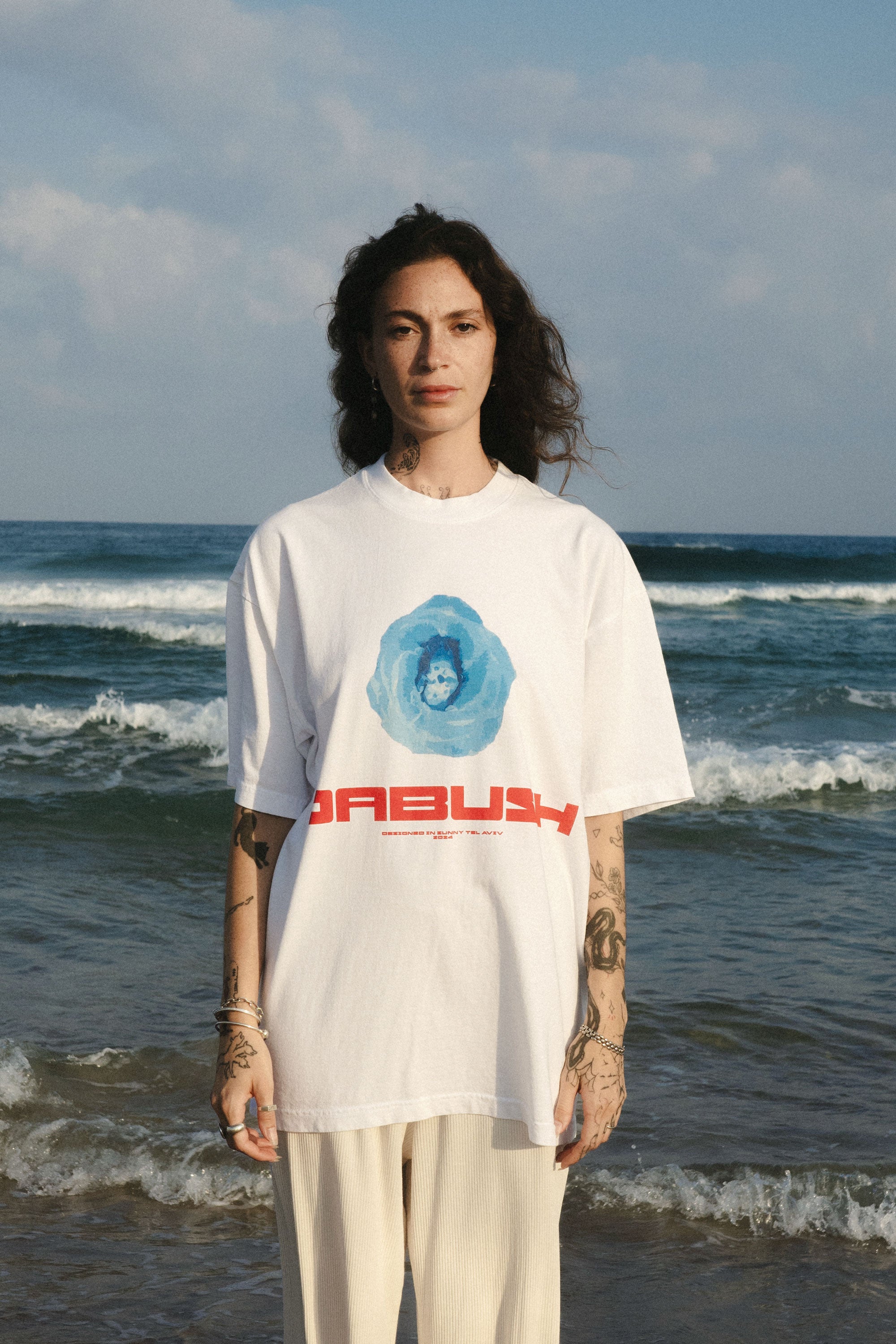 DABUSH T-SHIRTS. 100% Cotton, oversized tee with Back and front print. Made in Tel aviv. Shop and view the latest Drops from the official DABUSH website. Worldwide Shipping. DABUSH is a publishing house, design studio and a brand based in Tel Aviv, Israel.